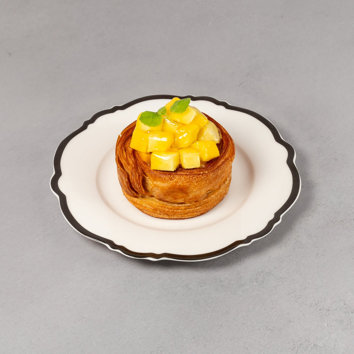 Small dessert on a white plate with a gray background