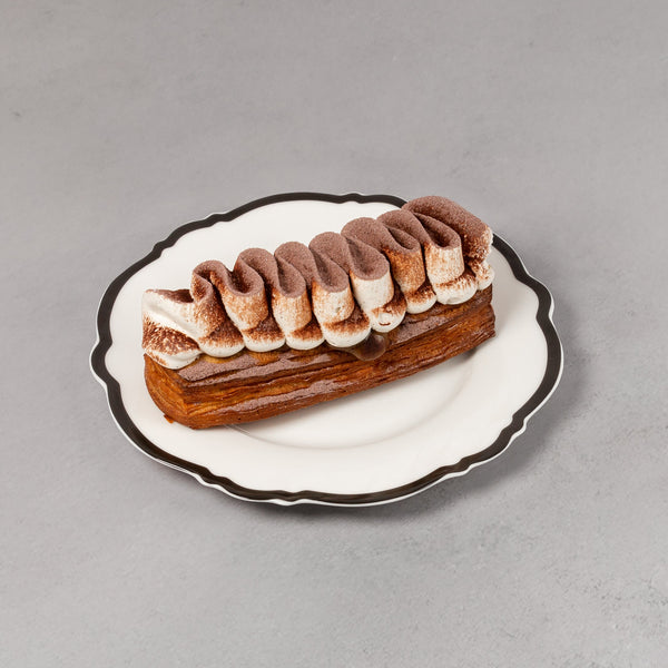 Small dessert on a white plate with a gray background